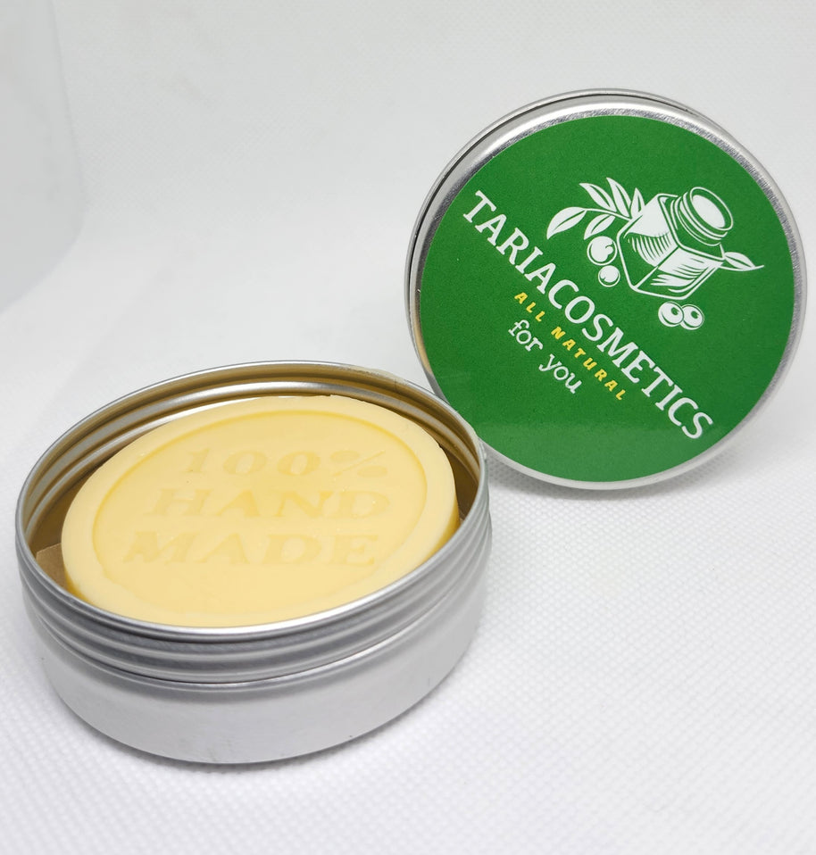 A round aluminum tin centered on a white background, featuring a green label with the TariaCosmetics branding.